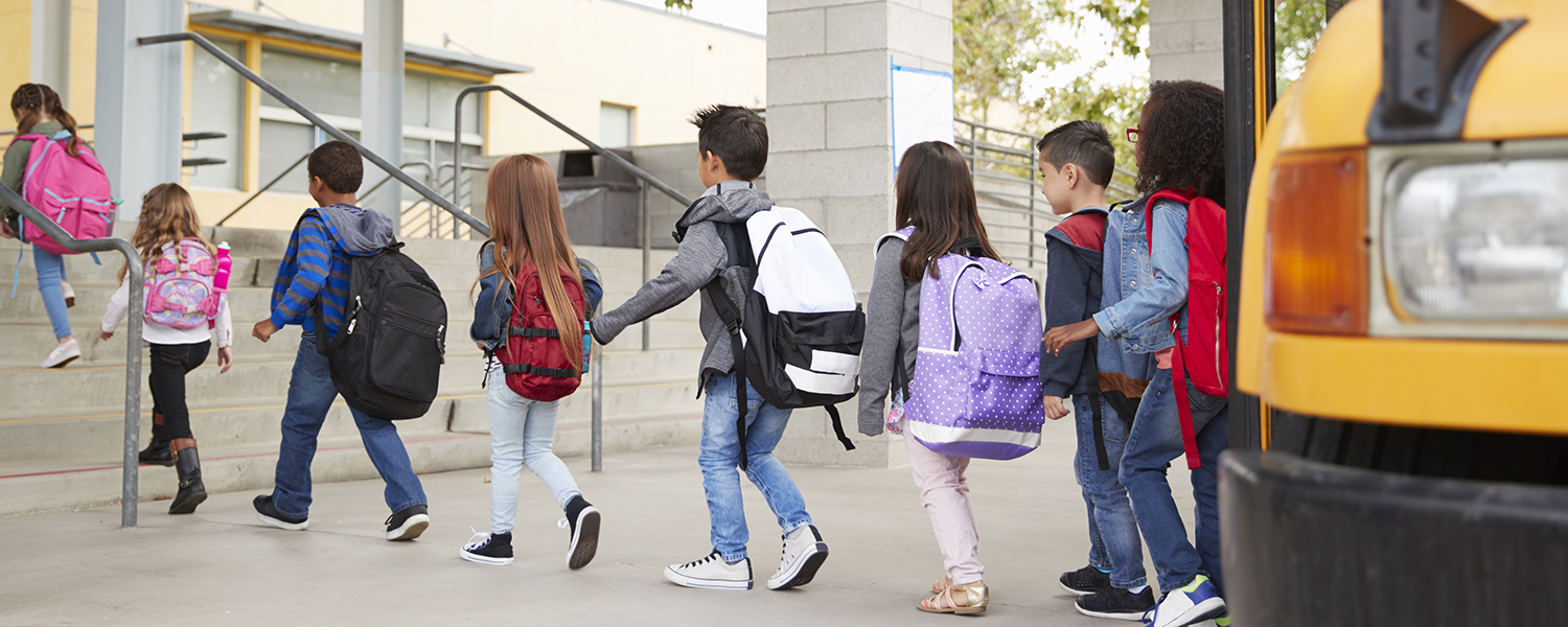 children getting off a school bus