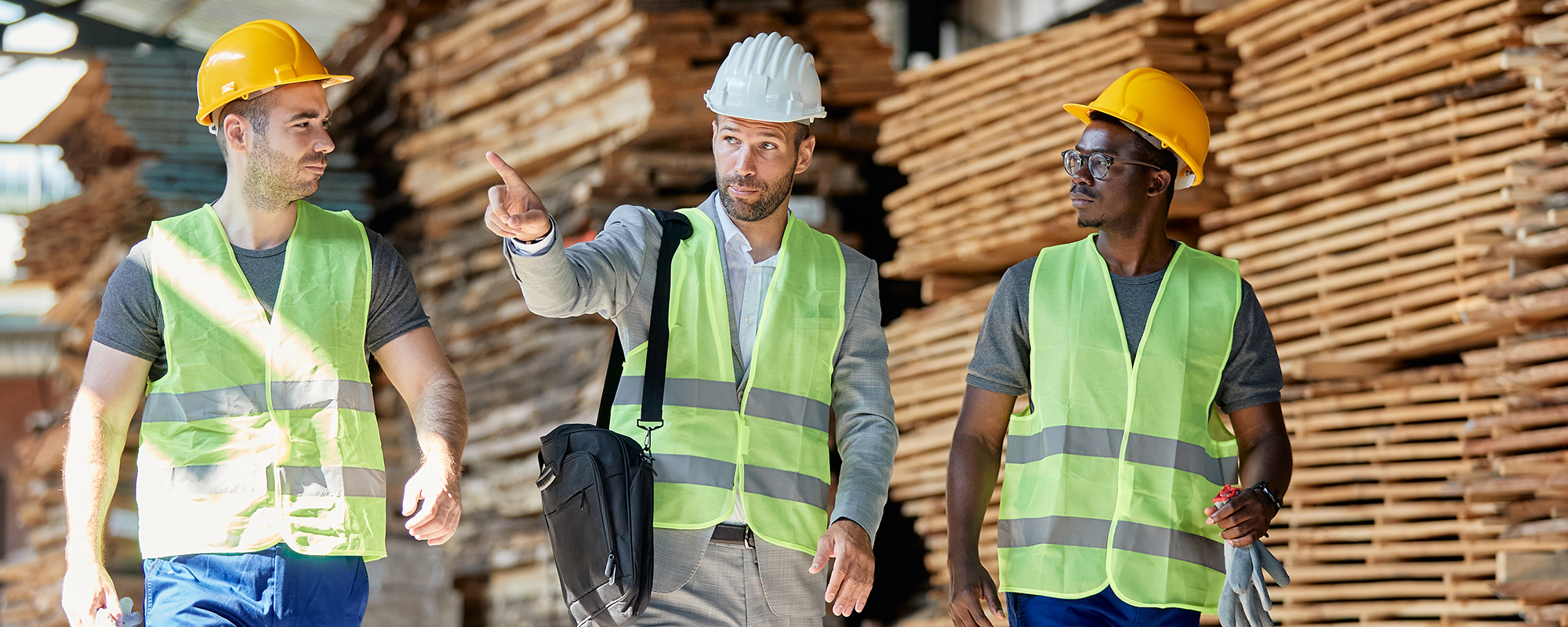 workers walking in lumber yard